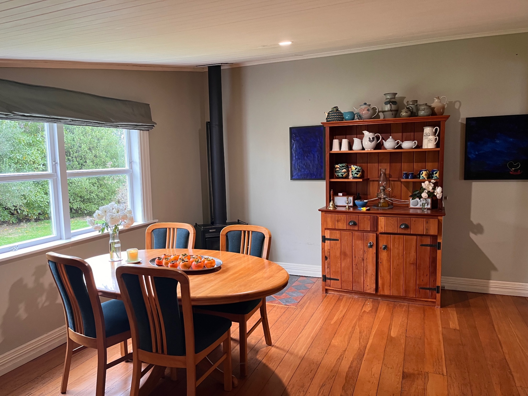 Dining area with a wooden hutch and set table